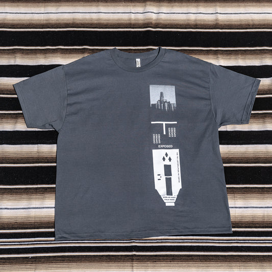 A gray t-shirt with a graphic print of a 120 film.