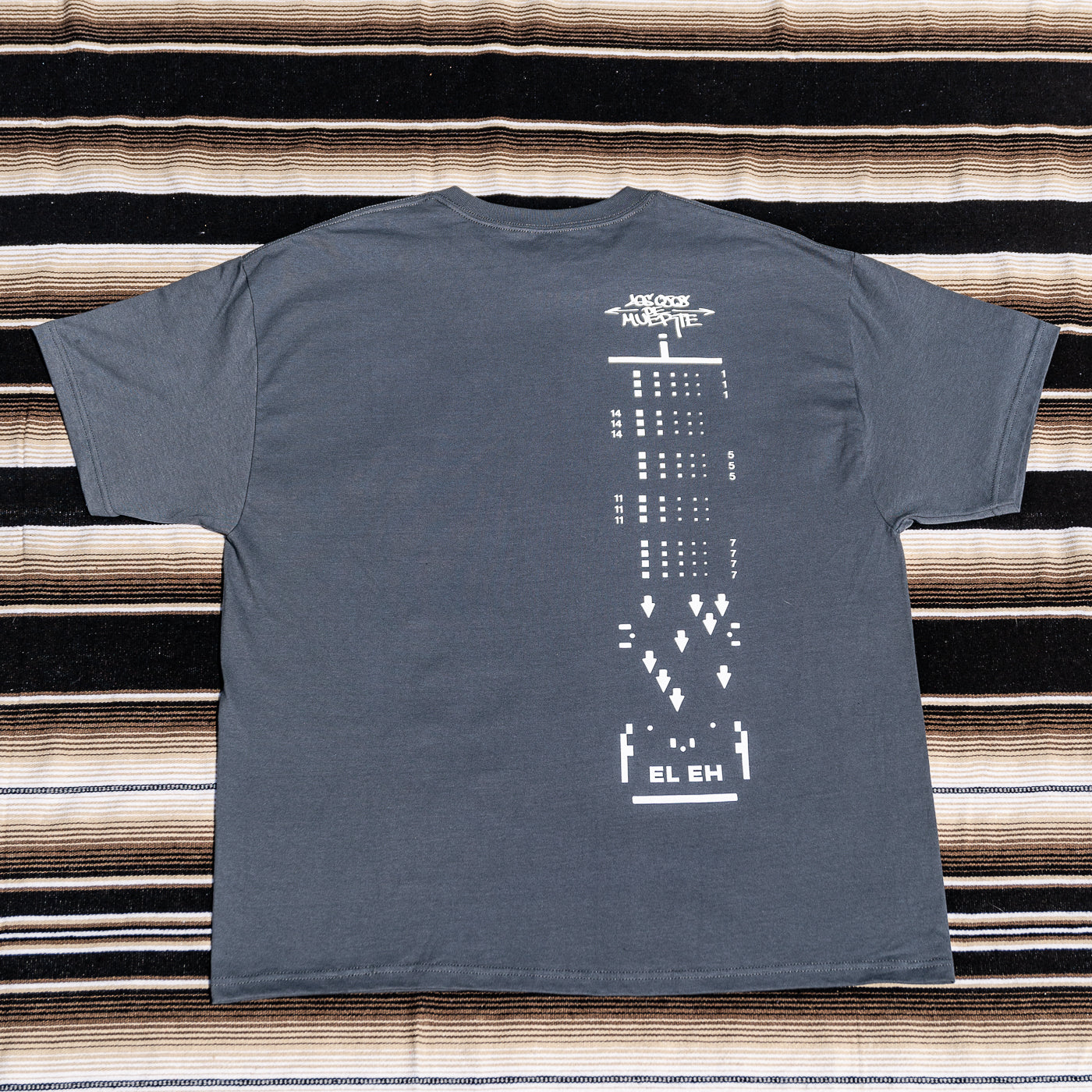 A gray t-shirt with a graphic print of a 120 film.